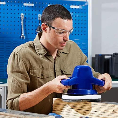 Man wearing Anti Fog Safety Glasses 12 Pack With UV Protection And Scratch Resistant Lenses using power sander in workshop