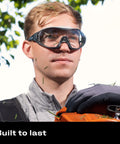 Man wearing Anti Fog Safety Goggles With Anti Scratch Coating And Adjustable Headband Z87.1 in outdoor work setting