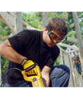 Clear Anti Fog Safety Goggles With Ventilation Channel worn by construction worker using power tool outdoors