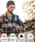 Man wearing Anti-Fog Indirectly Vented Lab Goggles Over Glasses Wide Vision Splash-Proof while using a chainsaw outdoors.