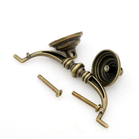 Four Piece Vintage Antique Brass Bail Pull Handle Set For Wooden Drawers Cabinets And Cupboards, shown with screws.