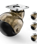 Close-up of a 2 Inch Antique Brass Ball Casters Without Brake Vintage Swivel Plate Caster Wheels Set of 4 for furniture.