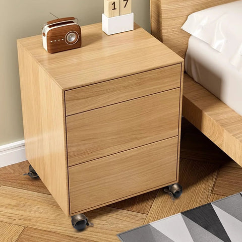 Wooden bedside cabinet on Eight Pack 2 Inch Antique Brass Ball Caster Wheels With Brakes, shown installed for mobility