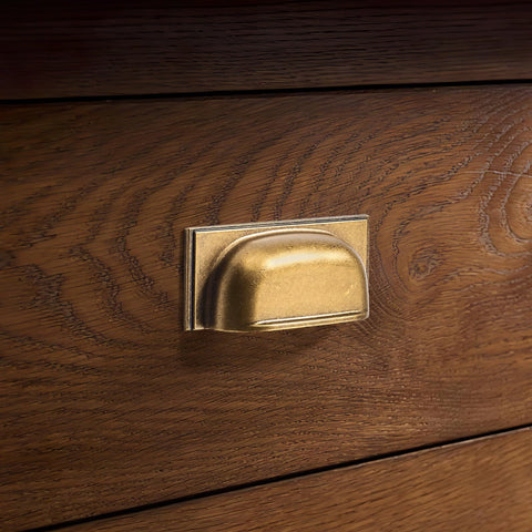 Close-up of antique brass cabinet cup pull on wooden drawer, part of 10 Pack Antique Brass Cabinet Cup Pulls 5 Inch 128mm Durable Zinc Alloy.