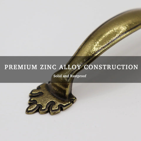 Close-up of 4 Pack Antique Brass Cabinet Handles With Vintage Decorative Drawer Pulls For Dresser Cupboard Wardrobe, zinc alloy material