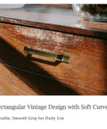 Antique Brass Rectangular Cabinet Handles 4 Pack With 3 Inch Hole Centers on wooden dresser, classic farmhouse style