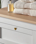White dresser with 30 Pack Antique Brass Cabinet Knobs 1-1/4 Inch Diameter Round Solid Zinc Alloy Drawer Pulls.