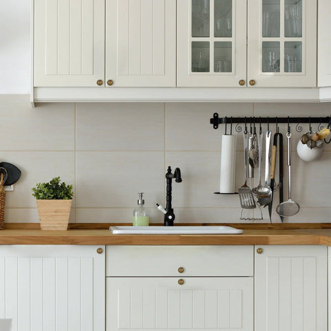 Antique Brass Cabinet Knobs 10 Pack For Kitchen Cabinets And Drawers installed in white kitchen shown on cabinet doors