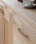 10 Pack Antique Brass Cabinet Pulls Three And Three Quarter Inch Center To Center Spacing shown on wooden dresser
