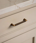 Antique Brass Cabinet Pulls Set Five Inch Center Knurled Vintage Drawer Pulls installed on a dresser for corrosion resistance