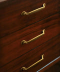 Set Of Six Traditional Five Inch Center To Center Antique Brass Cabinet Pulls With Curved Classic Design For Vintage Inspired Kitchens And Cabinets Durable Sturdy Metal Hardware For Drawers And Doors Easy To Install on wooden drawers