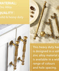 Antique Brass Cabinet Pulls 5 Inch Center To Center Zinc Alloy Solid Drawer Handles 6 Pack, close-up and installed on cabinet