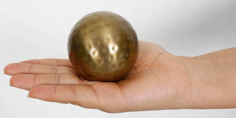 Hand holding 2.75 inch Decorative Ball, Sphere Bowl/Vase Filler, Antique Brass
