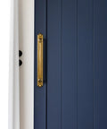 Antique Brass Drawer Pulls With Backplate Center To Center Five Point Zero Four Inches installed on a blue cabinet door