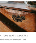 Antique Brass Drawer Pulls 8 Pack With 2-1/2 Inch Hole Centers on dresser showing Victorian style handle detail