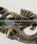 Close-up of Antique Brass Drop Bail Drawer Pull showing zinc alloy construction and vintage style design elements.