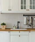 Kitchen with Antique Brass Kitchen Cabinet Knobs Set Of 10 installed on white cabinets and drawers, durable alloy construction.