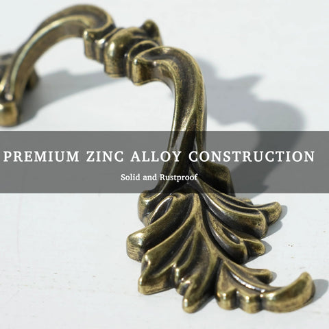 Close-up of Antique Brass Drawer Pulls Set Of 6 With Leaf Inspired Design For Dresser Cupboard And Bedroom Furniture, 2-1/2 Inch Hole Center Cabinet Handles showcasing zinc alloy construction.