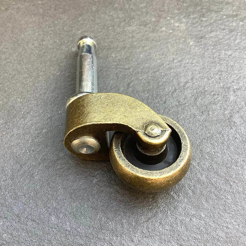 1 Inch Swivel Stem Ball Caster Wheel Zinc Alloy Antique Brass with Socket Mount showing brass finish and wheel design