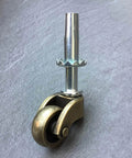 1 Inch Swivel Stem Ball Caster Wheel Zinc Alloy Antique Brass with Socket Mount 353 lb Capacity on gray surface