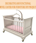 Wooden crib with pink bedding on 2 Inch Vintage Caster Wheels 4 Pack Antique Brass Swivel Ball Casters, displayed on a decorative nursery floor.