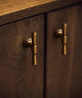 Antique Brass Cabinet Knobs Five Pack Single Hole Vintage Drawer Knobs Zinc Alloy Handles installed on wooden cabinet