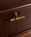 Antique Brass Cabinet Knob installed on wooden drawer, single hole zinc alloy handle, part of five pack for kitchen or bathroom use