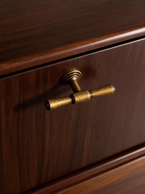 Antique Brass Cabinet Knob installed on wooden drawer, single hole zinc alloy handle, part of five pack for kitchen or bathroom use
