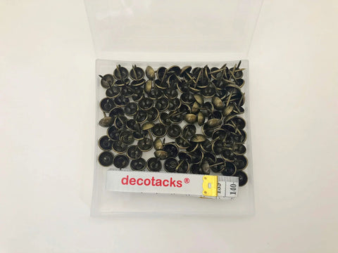 Antique brass upholstery tacks secure fabric, leather, and trim to wood frames and panels with a durable, decorative finish.