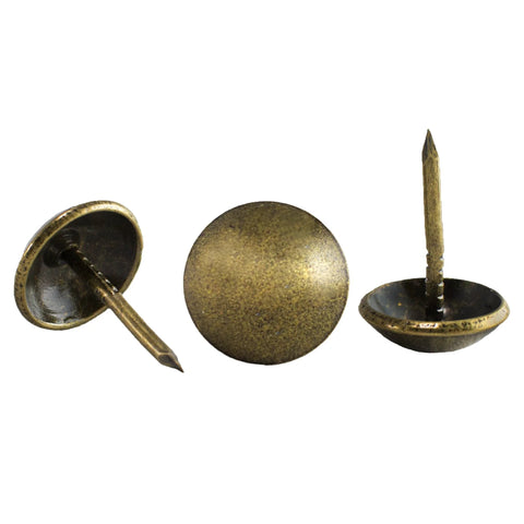Antique brass upholstery tacks secure fabric, leather, and trim to wood frames and panels with a durable, decorative finish, shown close-up