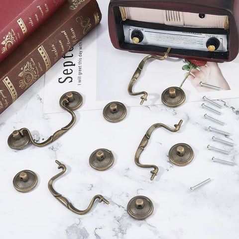 Four 3.6 Inch Vintage Bail Pull Handles Antique Bronze Furniture Hardware Set with screws on marble surface