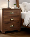 Brass Bronze Cup Drawer Pulls Set Twelve Pack Cabinet Cup Pulls For Kitchen And Furniture installed on a wooden nightstand.