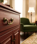4.5 Inch Center To Center Antique Bronze Drawer Pulls Pack Of 4 Bail Drop Swing Handles on dresser in living room