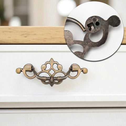 Front view of 4 pack 3.25 inch center to center antique bronze bail drawer pulls on white dresser with close-up detail.