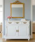 White dresser with 4 Pack 3.25 Inch Center To Center Antique Bronze Bail Drawer Pulls, in a living room with a gold mirror and blue walls.