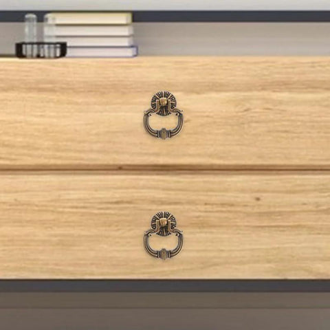 Vintage Drop Ring Pulls Set of 4 in Antique Bronze on wooden dresser in bedroom