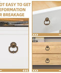 Vintage Drop Ring Pulls Set of 4 in Antique Bronze installed on white cabinet and wood dresser drawers