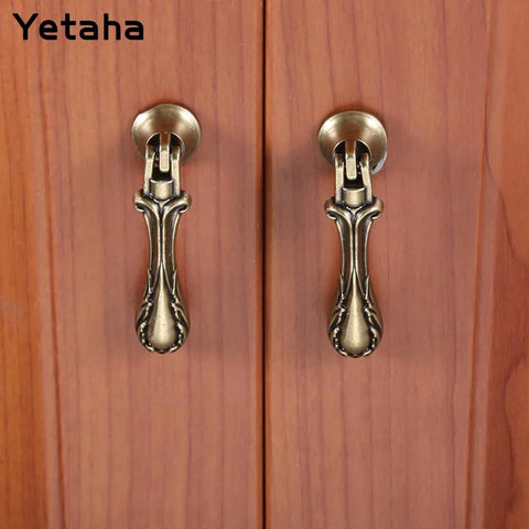 4 Pack Vintage Teardrop Pendant Pulls With Antique Bronze Finish Floral Carving Solid Zinc Alloy Handles installed on wood cabinet
