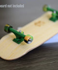 Apex 61D Slim Bowl Fingerboard Wheels With 7.5mm Urethane And ABEC 9 Stealth Bearings, installed on a wooden fingerboard.