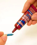 Applying Removable Thread Locker Blue 242 to bolt to prevent loosening and corrosion, medium strength, ideal for power equipment, 6 ml pack.