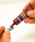 Applying Removable Thread Locker Blue 242 to bolt for medium strength fastening and corrosion prevention, ideal for small motors and mowers.