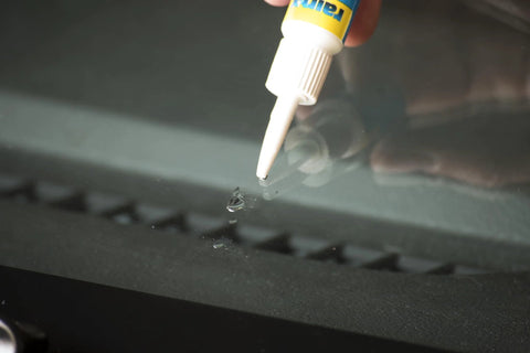 Applying Resin Based Windshield Repair Kit For Chips And Cracks Quick And Easy To Use Universal Repair System on windshield chip.