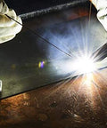 Welding with All Position E7018AC Welding Rod Three Thirty Second Inch One Pound Pack on metal surface, bright arc visible