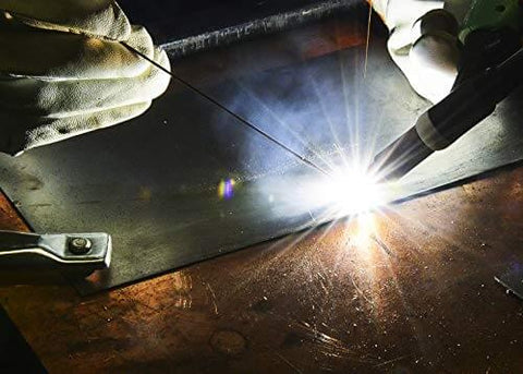 Welding with All Position E7018AC Welding Rod Three Thirty Second Inch One Pound Pack on metal surface, bright arc visible