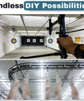 Archery range with bowstring pulled and overhead meat tracking rail system in industrial setup.
