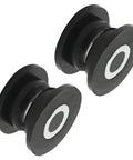 Close-up of two bushings from the Eight Piece Absorber Shock Bushing And Bearing Sleeve Kit For Arctic Cat ATVs Including Models 250 300 400