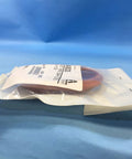 Side view of ARMSTRONG INTERNATIONAL A9330 Diaphragm, (HUMID 91;92;93;94) kit sealed in packaging against blue background