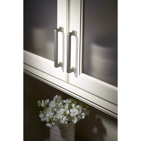 Ascendra 5-1/16 Inch Center To Center Cabinet Pull In Honey Bronze From The Transcend Series installed on white cabinets