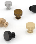 Assorted cabinet knobs in various finishes, including antique brass, displayed on white background for kitchen and furniture use.