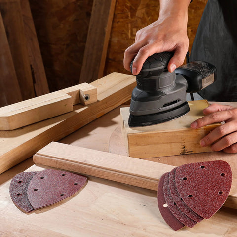 Using Assorted 150Pcs Mouse Sanding Pads 5 Hole Dust Extraction For Wood Furniture with a handheld sander on wooden surface